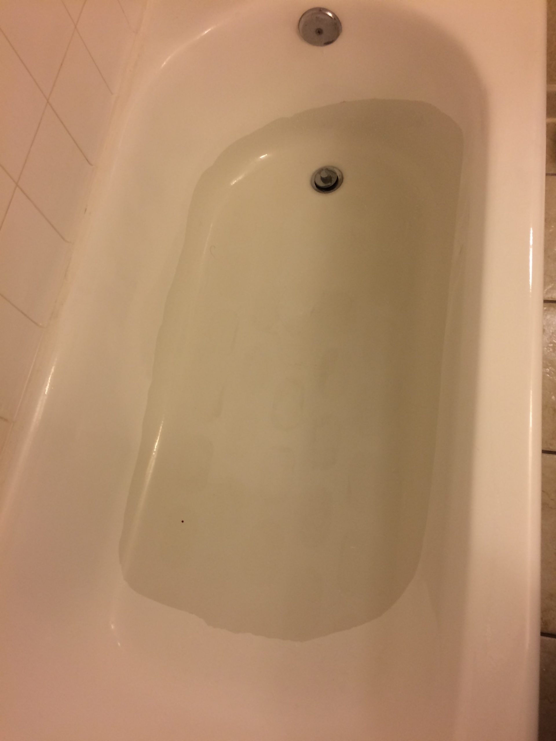 tub with strange coating - Hilton before